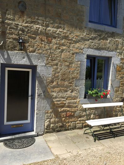 The front door and bench — a lovely spot to sit and enjoy a drink