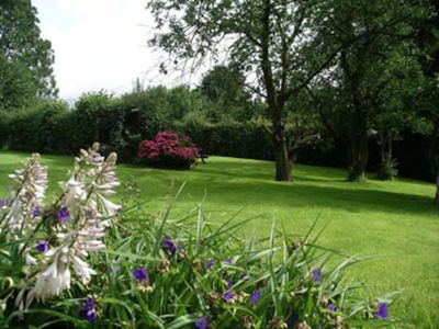 The large private front garden — barbecue and swings